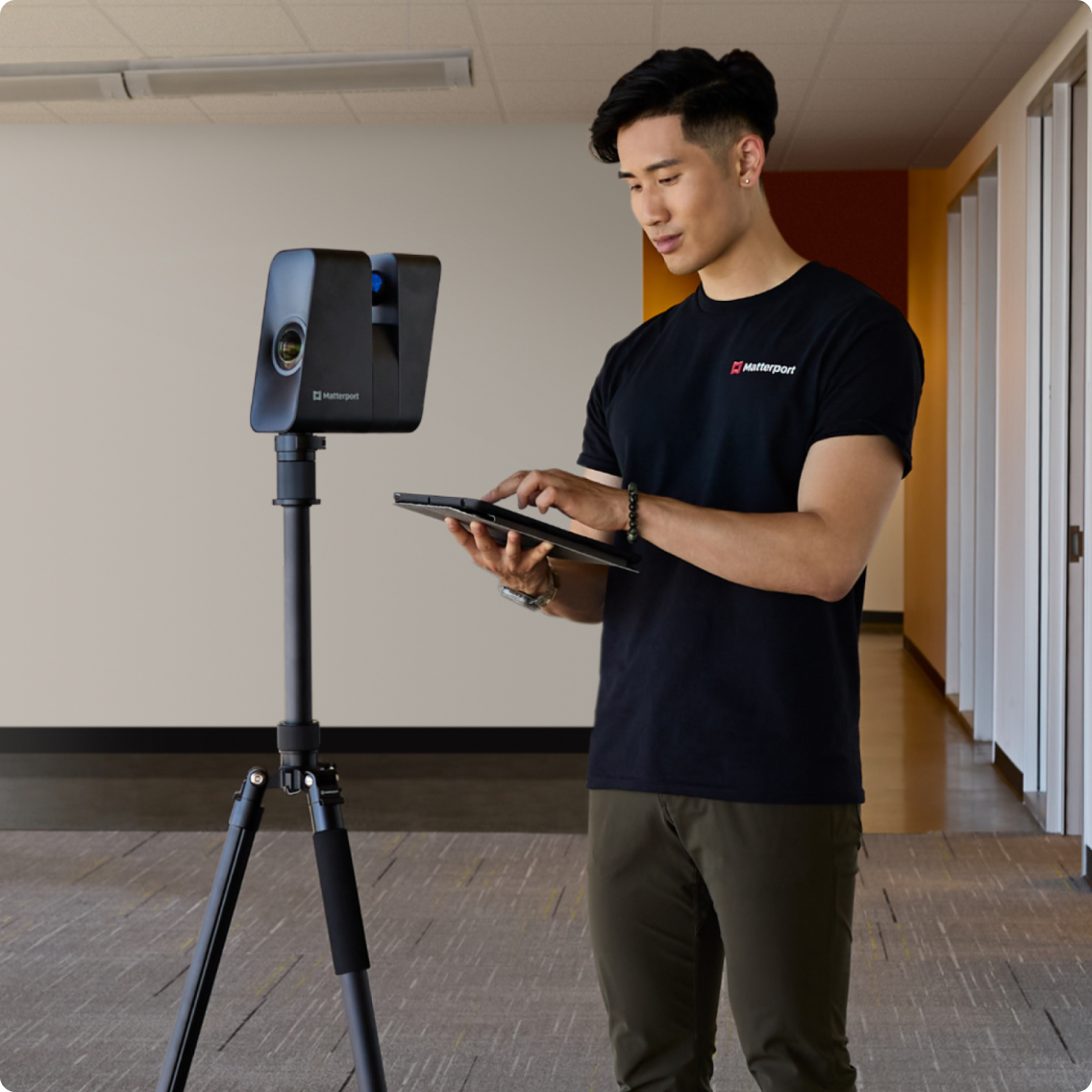 Capture Services technician scanning a room using a Matterport Pro3 camera