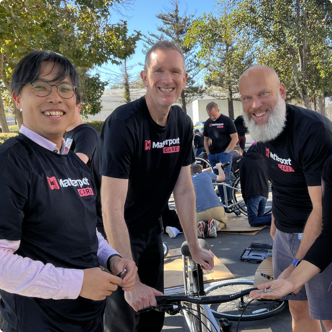 Matterport employees assembling bikes for charity